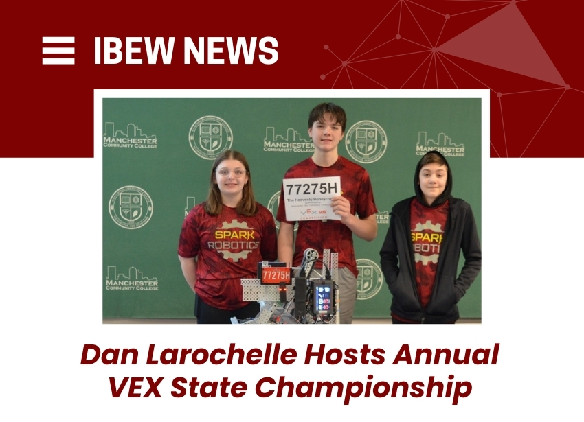 Three students with Spark Robotics shirts and VEX robot at Manchester Community College by IBEW Local 2320