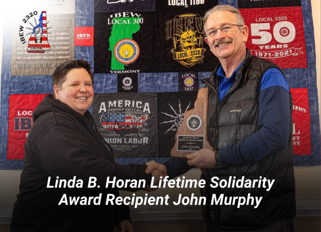 John Murphy receiving Linda B. Horan Lifetime Solidarity Award plaque by IBEW Local 2320