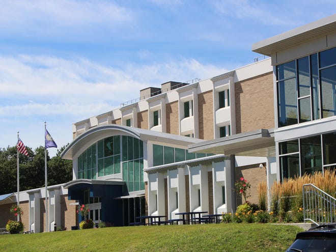 Great Bay Community College building with modern glass entrance in NH by IBEW Local 2320