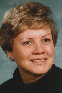 Portrait of woman with short light brown hair smiling by IBEW Local 2320